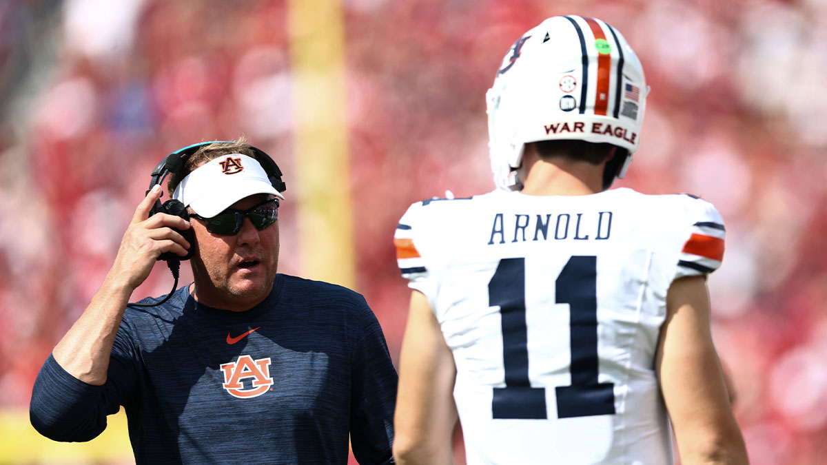 Auburn Tigers head coach Hugh Freeze speaks with Auburn Tigers quarterback Jackson Arnold (11) during the first half against the Oklahoma Sooners at Gaylord Family-Oklahoma Memorial Stadium.