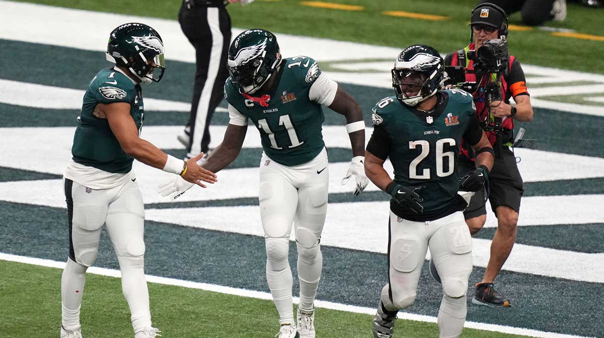 Philadelphia Eagles wide receiver A.J. Brown (11) reacts with quarterback Jalen Hurts (1) after making a touchdown catch against the Kansas City Chiefs during the second quarter in Super Bowl LIX at Caesars Superdome.
