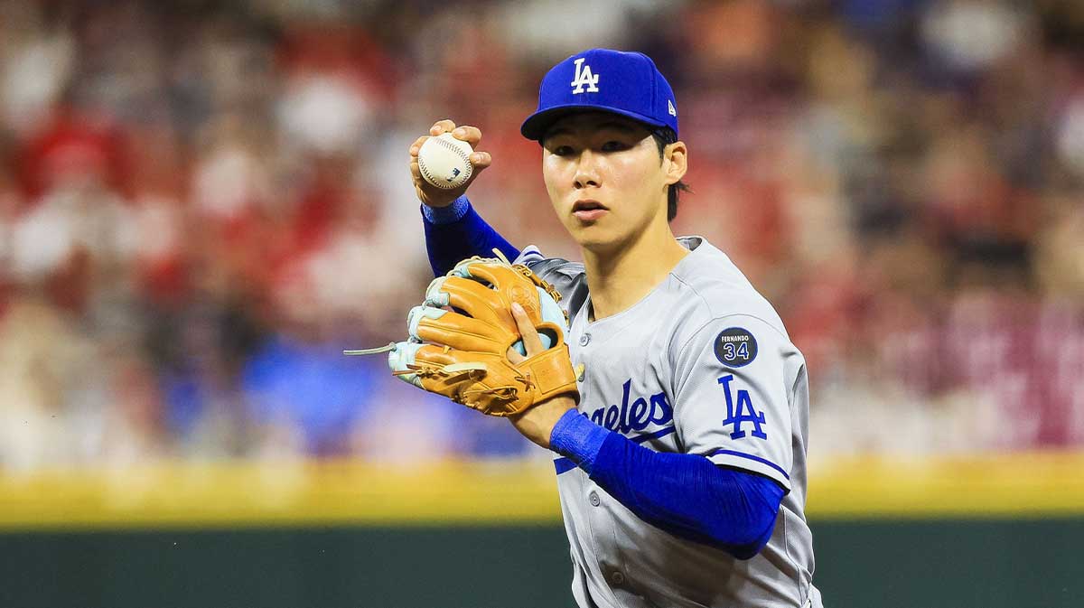 Los Angeles Dodgers second baseman Hyeseong Kim (6) throws to first to get Cincinnati Reds outfielder TJ Friedl (not pictured) out in the eighth inning at Great American Ball Park.