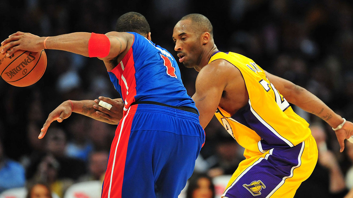 Los Angeles Lakers shooting guard Kobe Bryant (24) defends Detroit Pistons shooting guard Tracy McGrady (1) during the second half at the Staples Center.