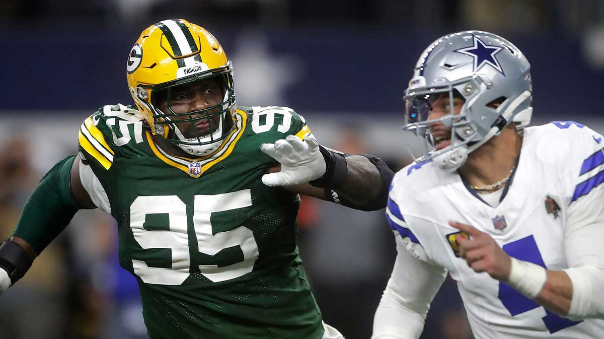Green Bay Packers defensive tackle Devonte Wyatt (95) rushes Dallas Cowboys quarterback Dak Prescott (4) during the fourth quarter of their wild card playoff game.