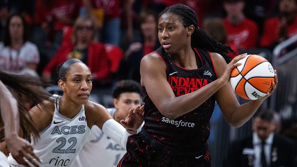 Indiana Fever forward Aliyah Boston (7) holds the ball while Las Vegas Aces center A'ja Wilson (22) defends in the second half during game four of the second round for the 2025 WNBA Playoffs at Gainbridge Fieldhouse.