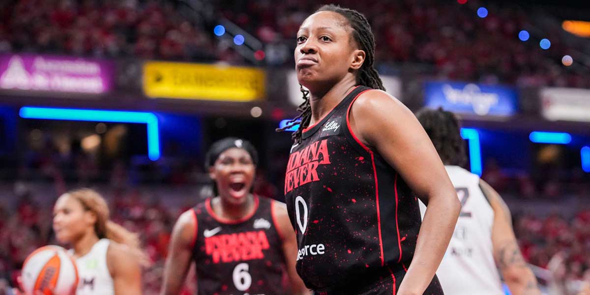 Indiana Fever guard Kelsey Mitchell (0) celebrates Tuesday, Sept. 16, 2025, during Game 2 of a WNBA playoff matchup between the Indiana Fever and the Atlanta Dream at Gainbridge Fieldhouse in Indianapolis. The Indiana Fever defeated the Atlanta Dream, 77-60.