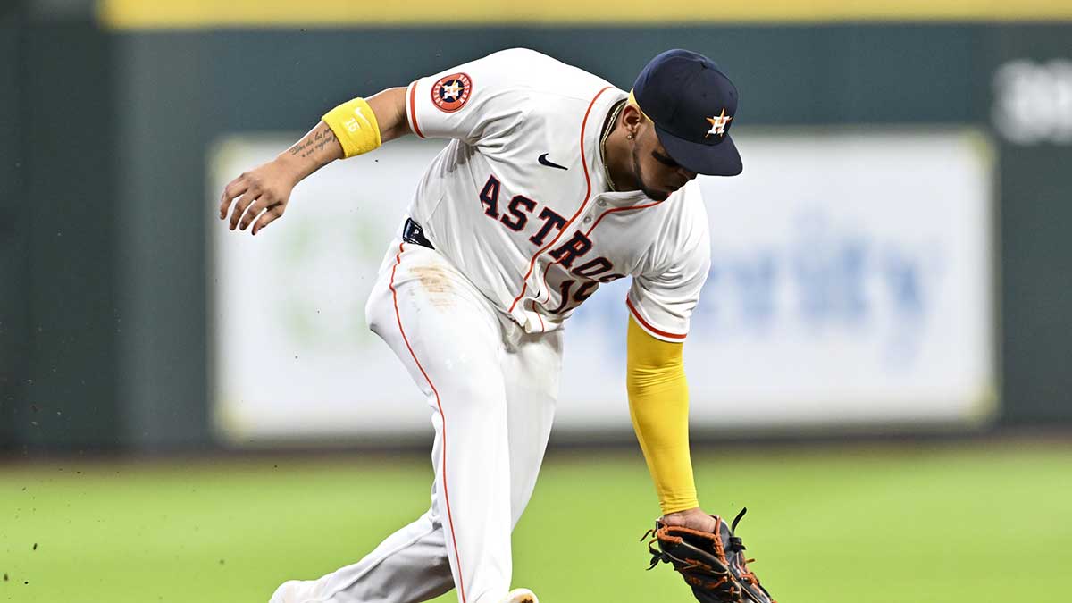 Houston Astros third baseman Isaac Paredes (15) fields a ground ball during the in the first inning against the Philadelphia Phillies at Daikin Park.