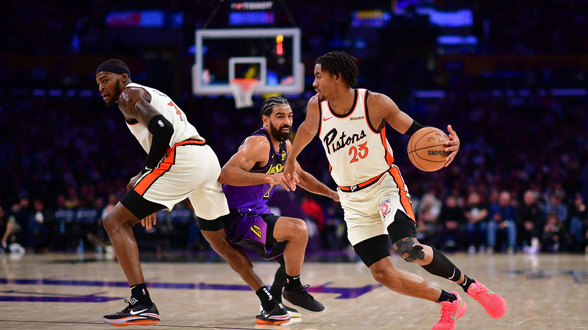 Detroit Pistons guard Jaden Ivey (23) moves the ball as forward Paul Reed (7) provides coverage against Los Angeles Lakers guard Gabe Vincent (7) during the first half at Crypto.com Arena.