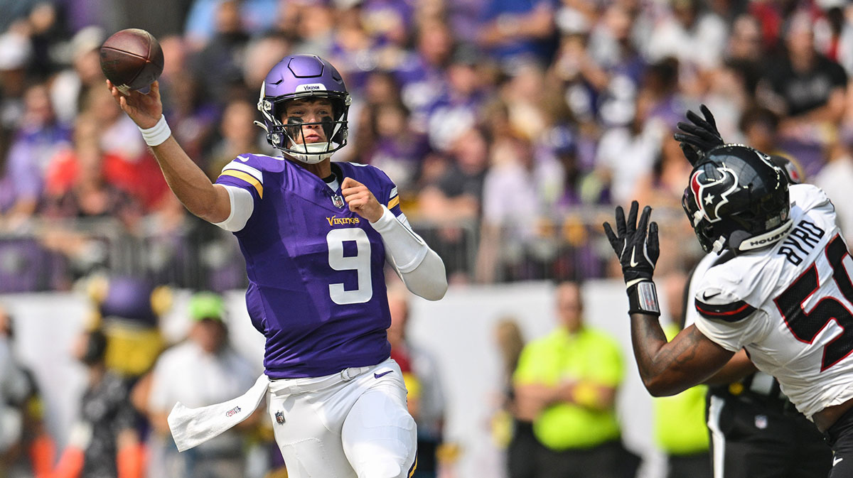 Minnesota Vikings quarterback J.J. McCarthy (9) throws a pass as Houston Texans defensive end Solomon Byrd (50) pursues during the first quarter at U.S. Bank Stadium.