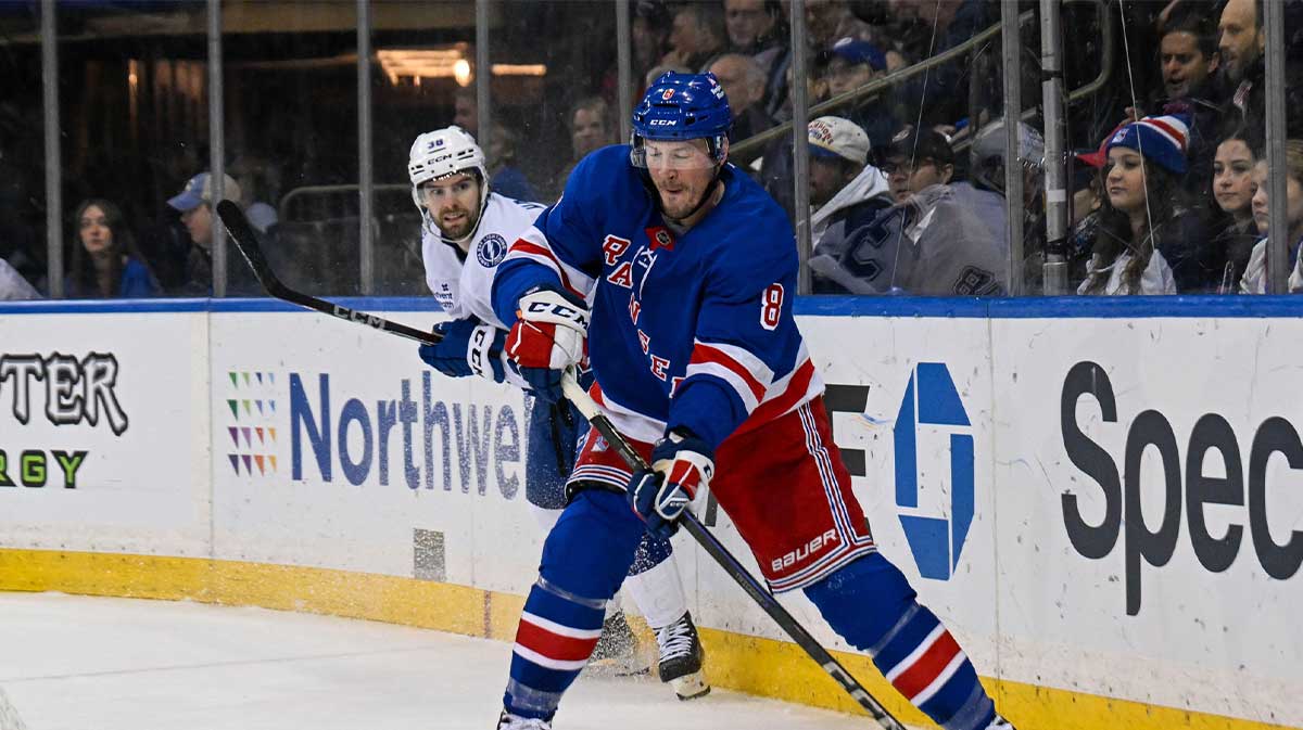 New York Rangers left wing J.T. Miller (8) makes a pass defended by Tampa Bay Lightning defenseman J.J. Moser (90) during the second period at Madison Square Garden.