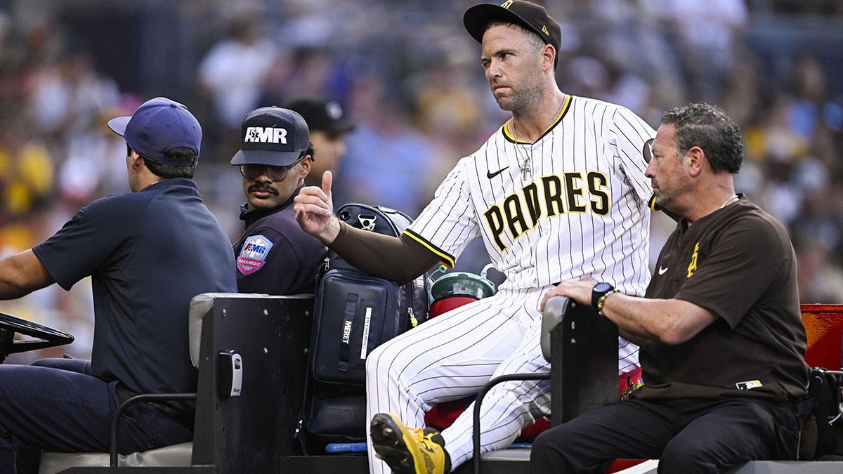 San Diego Padres relief pitcher Jason Adam (40) is taken away in a cart after being injured during the seventh inning against the Baltimore Orioles at Petco Park.