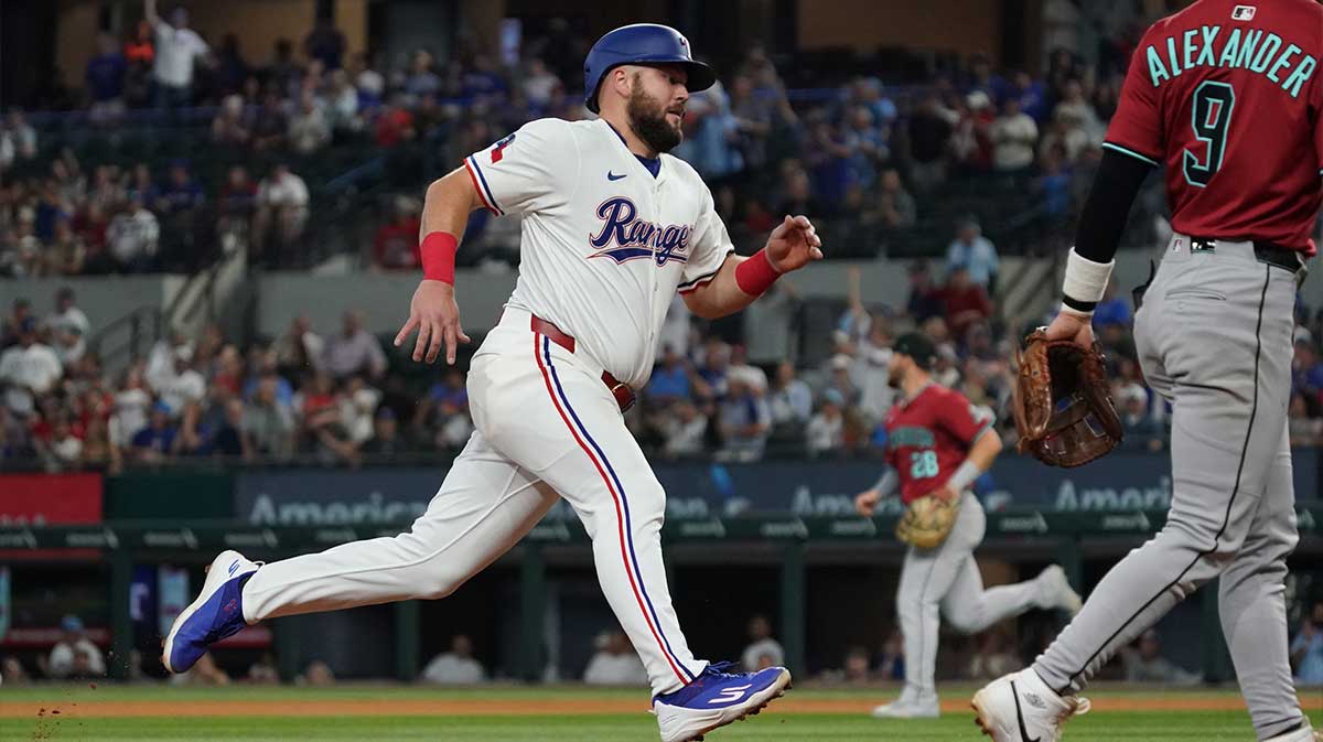 Texas Rangers first baseman Jake Burger (21) heads home to score during the eighth inning against the Arizona Diamondbacks at Globe Life Field.