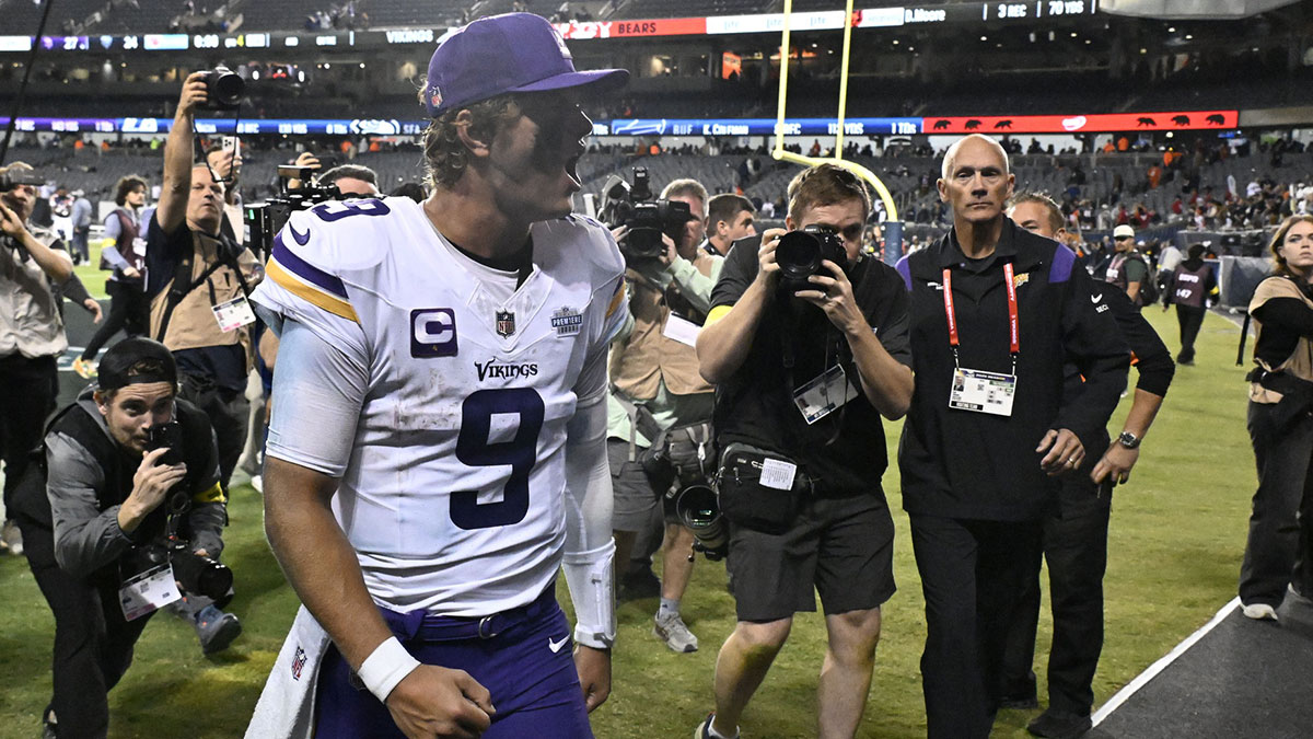 Minnesota Vikings quarterback J.J. McCarthy (9) reacts after defeating the Chicago Bears at Soldier Field.