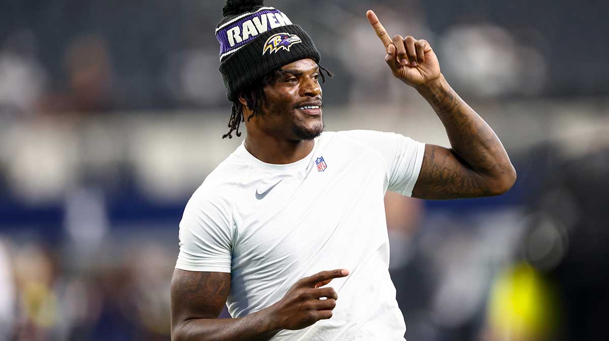 Baltimore Ravens quarterback Lamar Jackson (8) warms up before the game against the Dallas Cowboys at AT&T Stadium.