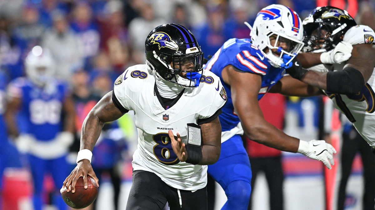 Baltimore Ravens quarterback Lamar Jackson (8) runs the ball during the fourth quarter against the Buffalo Bills at Highmark Stadium.