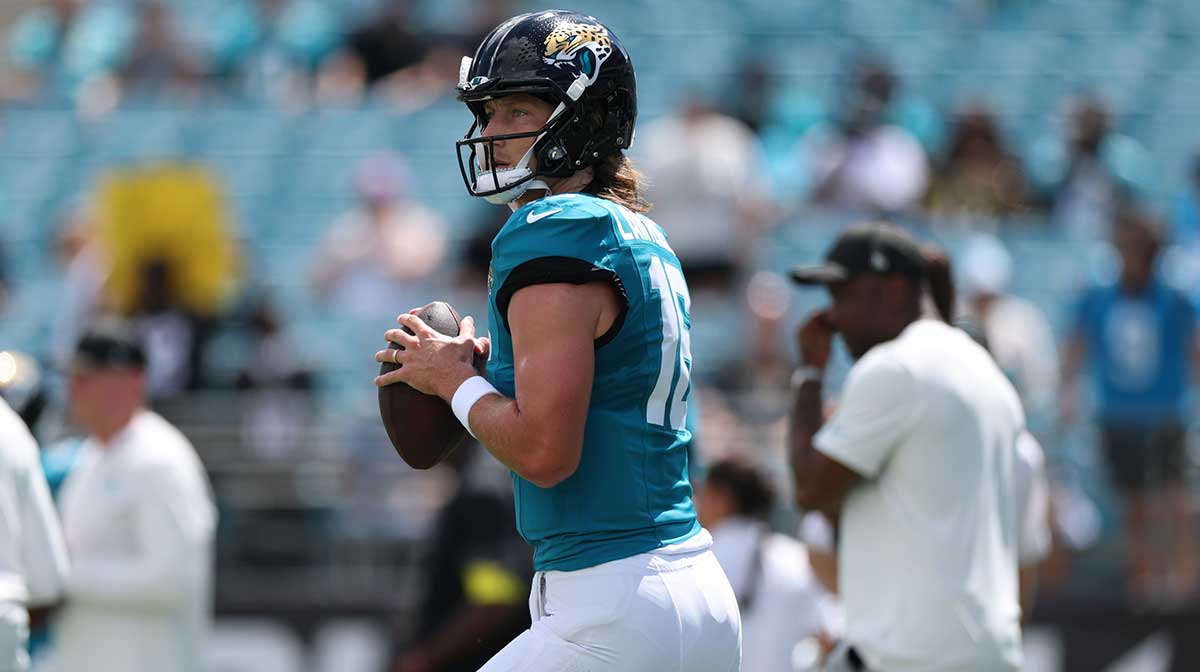 Jacksonville Jaguars quarterback Trevor Lawrence (16) warms up prior to a game against the Carolina Panthers at EverBank Stadium.