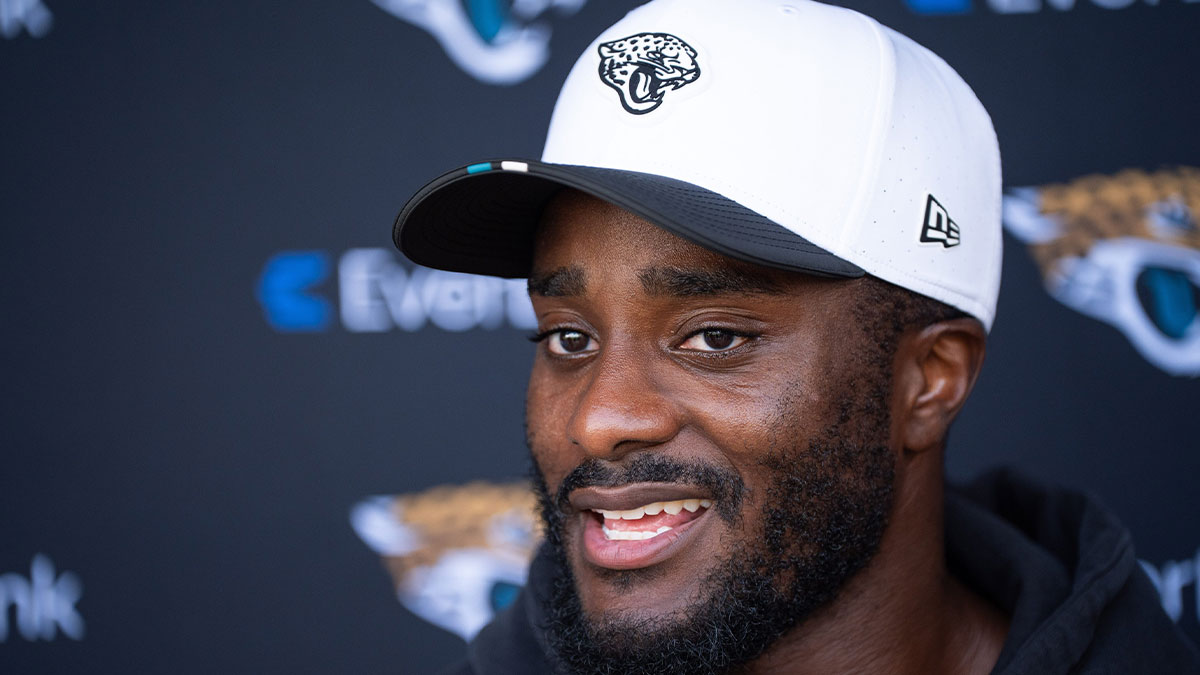 Jaguars cornerback Jourdan Lewis (2) answers questions after the Jaguar’s 12th NFL training camp session at the Miller Electric Center, Thursday, Aug. 7, 2025, in Jacksonville, Fla with Cowboys logo
