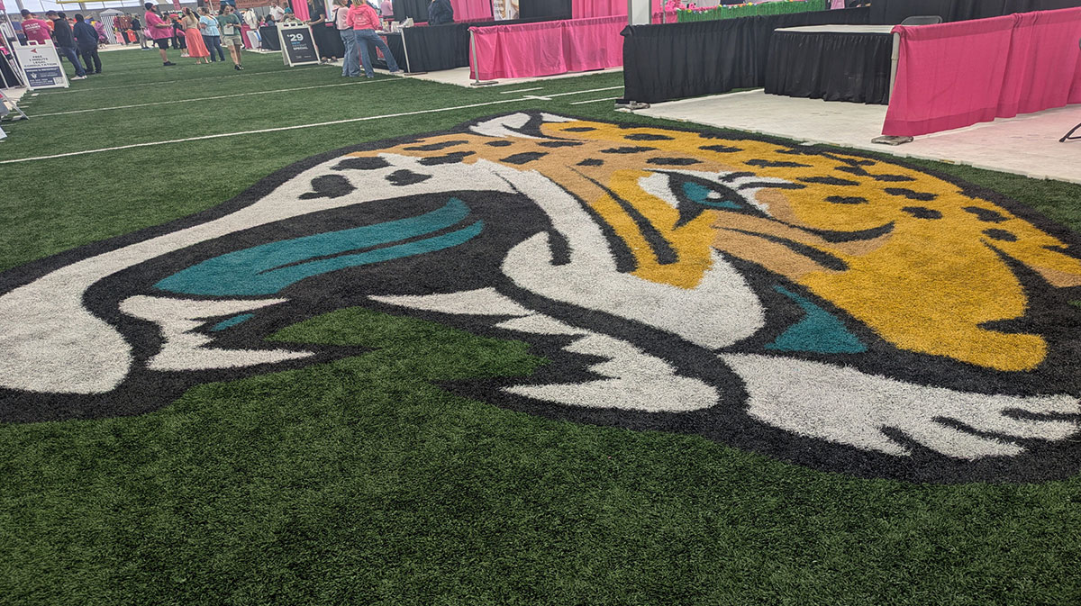 Donna Marathon Expo booths surround the Jacksonville Jaguars logo inside the Daily's Place flex field.