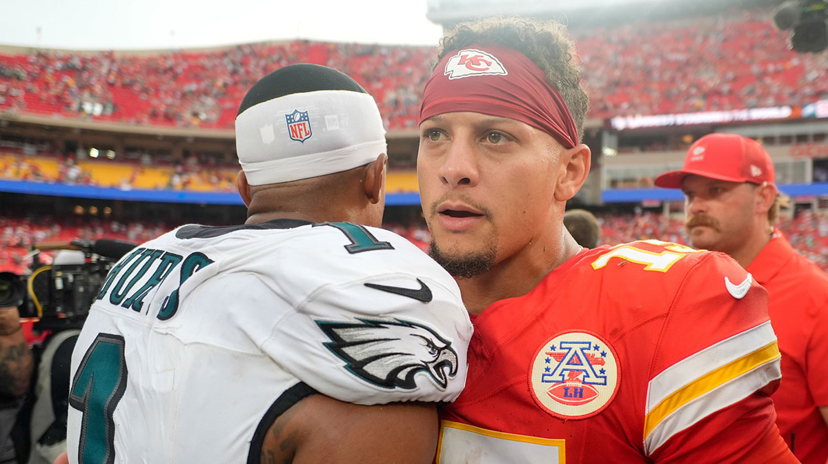 Philadelphia Eagles quarterback Jalen Hurts (1) and Kansas City Chiefs quarterback Patrick Mahomes (15) greet eachother after the game at GEHA Field at Arrowhead Stadium.