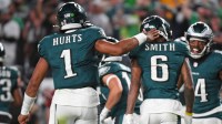Philadelphia Eagles quarterback Jalen Hurts (1) and wide receiver DeVonta Smith (6) celebrate touchdown during the second quarter against the Atlanta Falcons at Lincoln Financial Field.