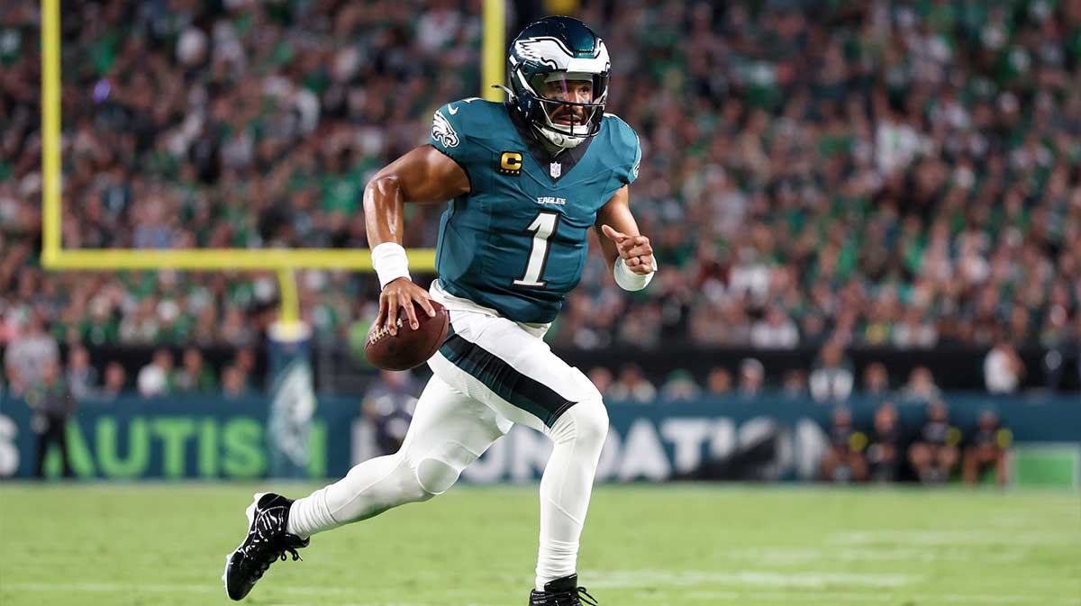 Philadelphia Eagles quarterback Jalen Hurts (1) carries the ball for a touchdown against the Dallas Cowboys during the second quarter of the game at Lincoln Financial Field.