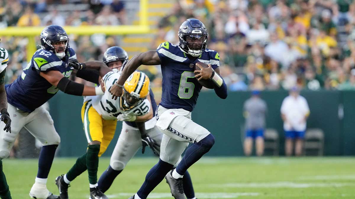 Seattle Seahawks quarterback Jalen Milroe (6) rushes with the football during the fourth quarter against the Green Bay Packers at Lambeau Field.