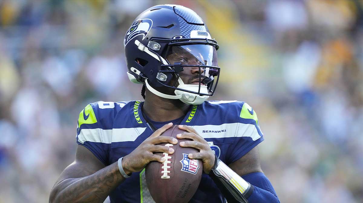 Seattle Seahawks quarterback Jalen Milroe (6) warms up near the sidelines during the game against the Green Bay Packers at Lambeau Field.