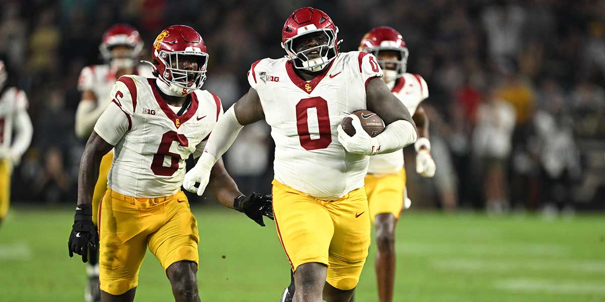 USC Trojans defensive tackle Jamaal Jarrett (0) runs the ball in for a touchdown after intercepting it during the second half against the Purdue Boilermakers at Ross-Ade Stadium.