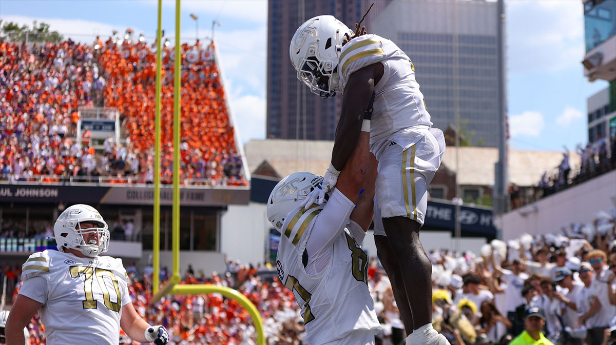 Georgia Tech Yellow Jackets running back Jamal Haynes (1) celebrates after a touchdown with offensive lineman Henry Peagler (60) against the Clemson Tigers in the second quarter at Bobby Dodd Stadium at Hyundai Field.