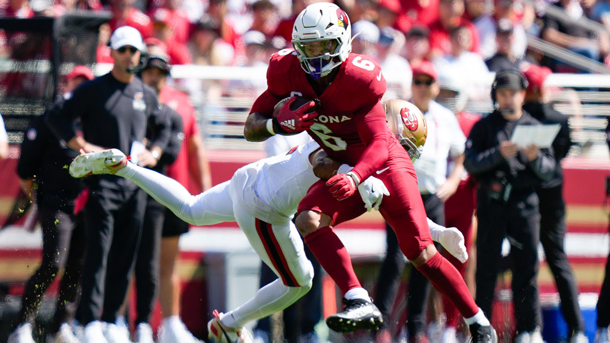 Arizona Cardinals running back James Conner (6) avoids the tackle by. San Francisco 49ers cornerback Deommodore Lenoir (2) during the first half at Levi's Stadium.