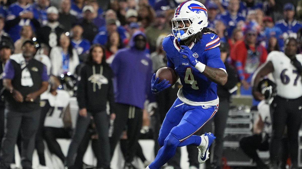 Buffalo Bills running back James Cook (4) runs the ball against Baltimore Ravens during the third quarter at Highmark Stadium.