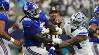 New York Giants offensive tackle James Hudson III (55) is called for a unnecessary roughness after a play against Dallas Cowboys defensive end Sam Williams (54) during the first quarter at AT&T Stadium.