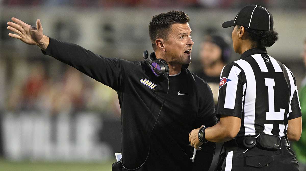 James Madison Dukes head coach Bob Chesney argues a call with an official during the first half against the Louisville Cardinals at L&N Federal Credit Union Stadium.