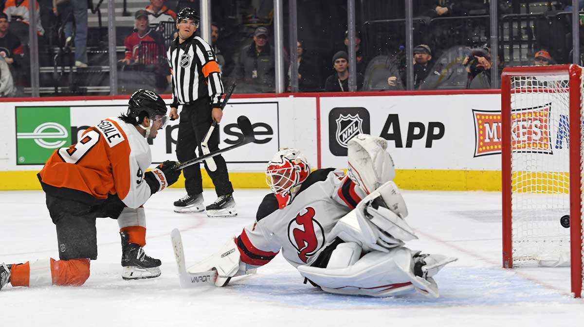 Philadelphia Flyers defenseman Jamie Drysdale (9) scores a goal past New Jersey Devils goaltender Jake Allen (34) during the third period at Wells Fargo Center.