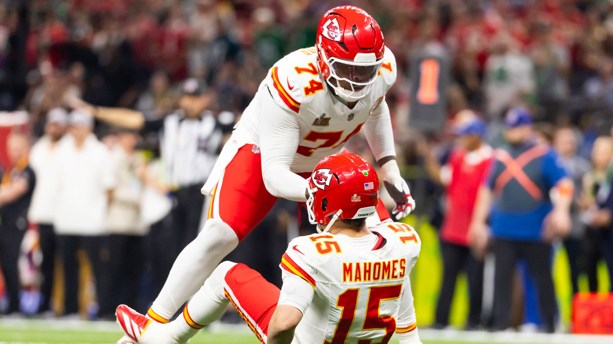 Kansas City Chiefs offensive lineman Jawaan Taylor helping Patrick Mahomes up in Super Bowl 59.