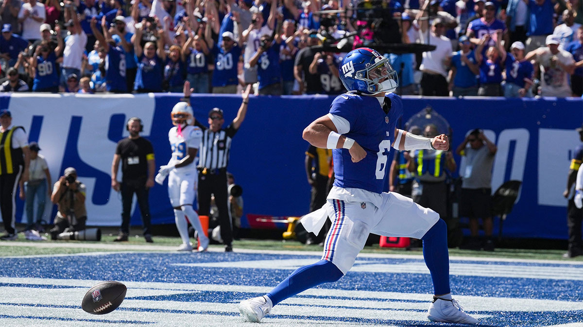 New York Giants quarterback Jaxson Dart, who scored his first touchdown against the Los Angeles Chargers, which fellow Ole Miss alum Eli Manning reacted to.
