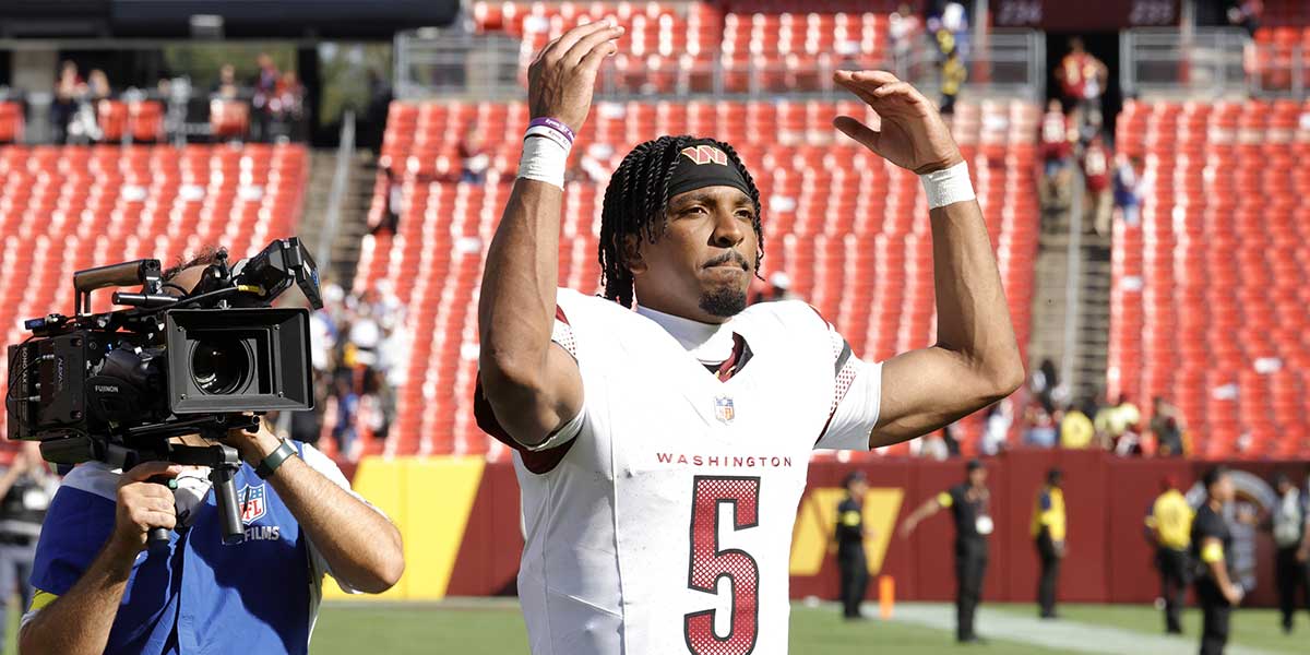 Washington Commanders quarterback Jayden Daniels (5) walks off the field after the game against the New York Giants at Northwest Stadium.