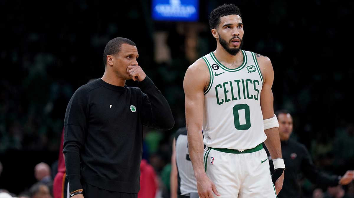 Boston Celtics head coach Joe Mazzulla and forward Jayson Tatum (0) talk during the first half against the Miami Heat in game two of the Eastern Conference Finals for the 2023 NBA playoffs at TD Garden.