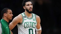 Boston Celtics head coach Joe Mazzulla talks with forward Jayson Tatum (0) from the sideline as they take on the Brooklyn Nets at TD Garden.