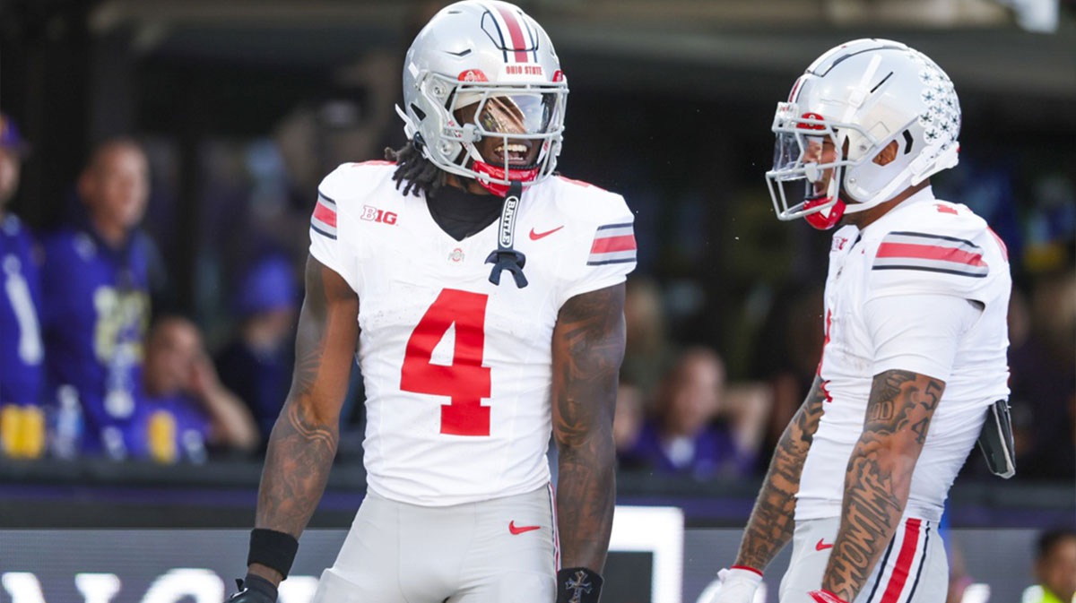 Ohio State Buckeyes wide receiver Jeremiah Smith (4) celebrates with wide receiver Brandon Inniss (1) after catching a touchdown pass against the Washington Huskies during the second quarter at Husky Stadium.