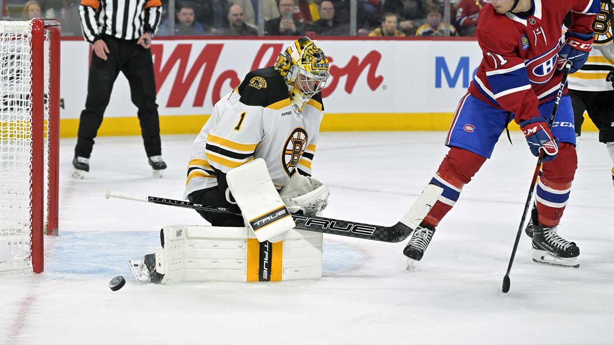 Boston Bruins goalie Jeremy Swayman (1) stops Montreal Canadiens forward Jake Evans (71) during the second period at the Bell Centre.