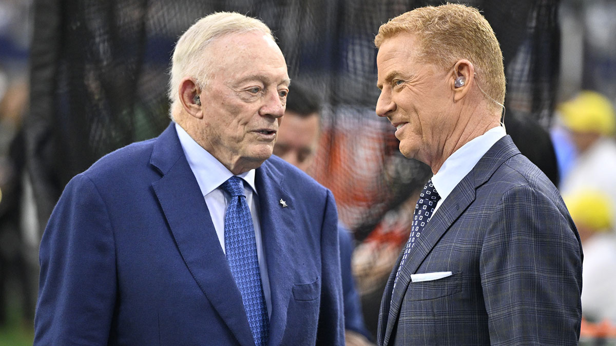 Dallas Cowboys owner Jerry Jones and NBC commentator Jason Garrett speak before the game against the Green Bay Packers at AT&T Stadium.