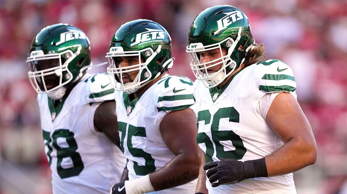 New York Jets center Joe Tippmann (66) walks to the line of scrimmage with offensive tackle Morgan Moses (left) and guard Alijah Vera-Tucker (center) during the first quarter against the San Francisco 49ers at Levi's Stadium.