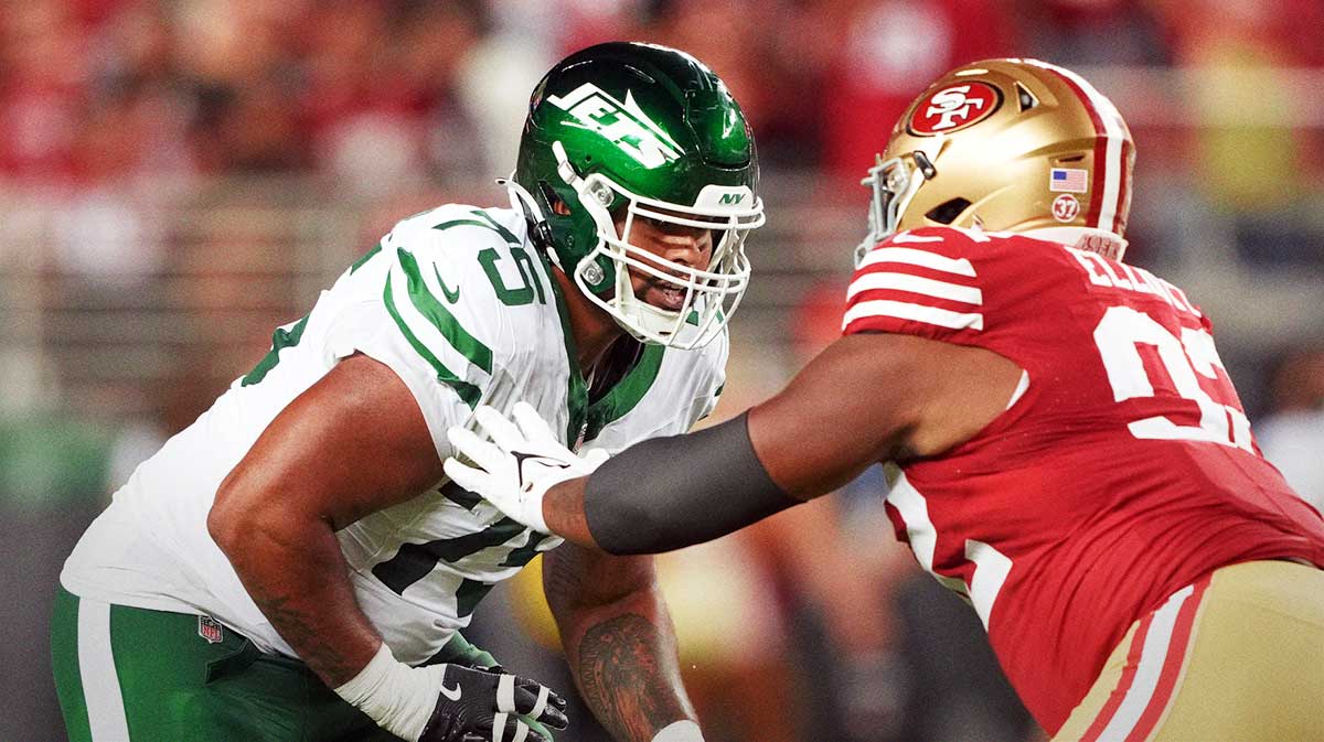 New York Jets guard Alijah Vera-Tucker (75) blocks against San Francisco 49ers defensive tackle Jordan Elliott (right) during the fourth quarter at Levi's Stadium.