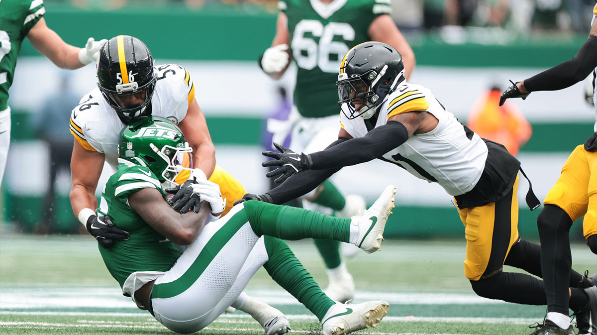 New York Jets wide receiver Tyler Johnson (16) is tackled by Pittsburgh Steelers linebacker Alex Highsmith (56) and safety Chuck Clark (21) at MetLife Stadium.