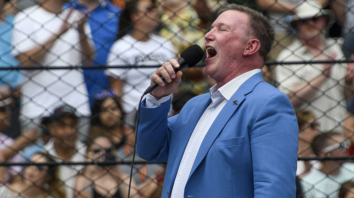Jim Cornelison sings \"Back Home Again in Indiana\" before the start of the Indianapolis 500 at Indianapolis Motor Speedway on Sunday,
