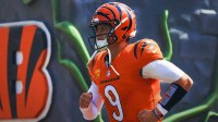 Cincinnati Bengals quarterback Joe Burrow (9) runs onto the field before the game against the Jacksonville Jaguars at Paycor Stadium.