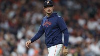Houston Astros manager Joe Espada (19) walks to the dugout after a pitching change during the seventh inning against the Los Angeles Angels at Daikin Park.