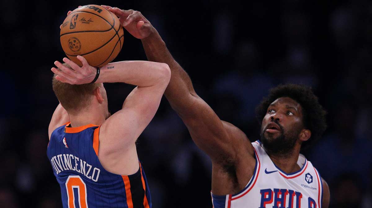 Philadelphia 76ers center Joel Embiid (21) blocks a shot by New York Knicks guard Donte DiVincenzo (0) during the first quarter of game 5 of the first round of the 2024 NBA playoffs at Madison Square Garden.