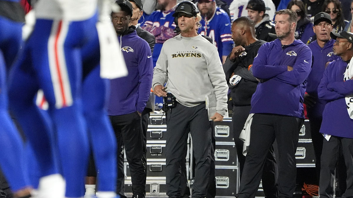 Baltimore Ravens head coach John Harbaugh watches from the sideline during the first half at Highmark Stadium.