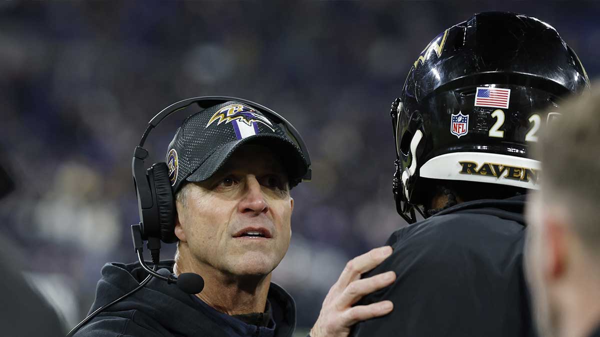 Baltimore Ravens head coach John Harbaugh celebrates with running back Derrick Henry (22) after defeating the Pittsburgh Steelers in an AFC wild card game at M&T Bank Stadium.