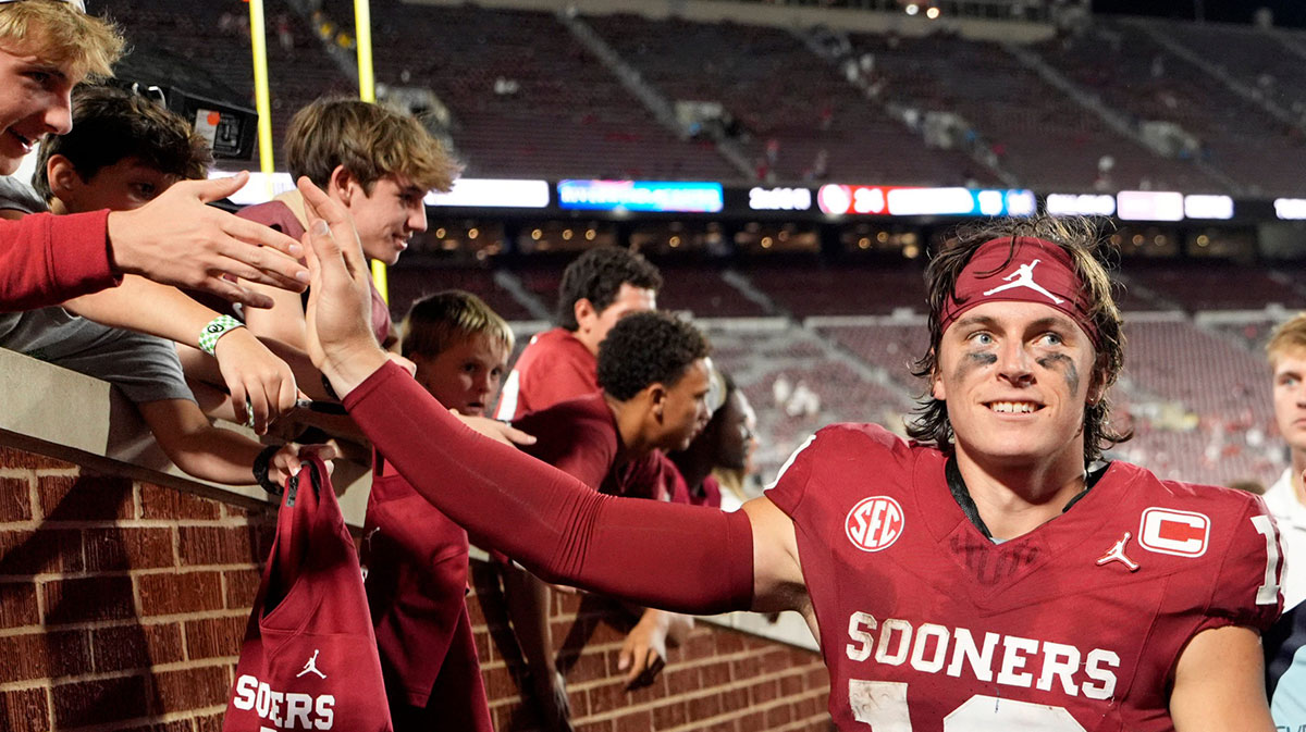 Oklahoma's John Mateer (10) greets following the college football game between the University of Oklahoma Sooner and the University of Michigan Wolverines at the Gaylord Family Ð Oklahoma Memorial Stadium