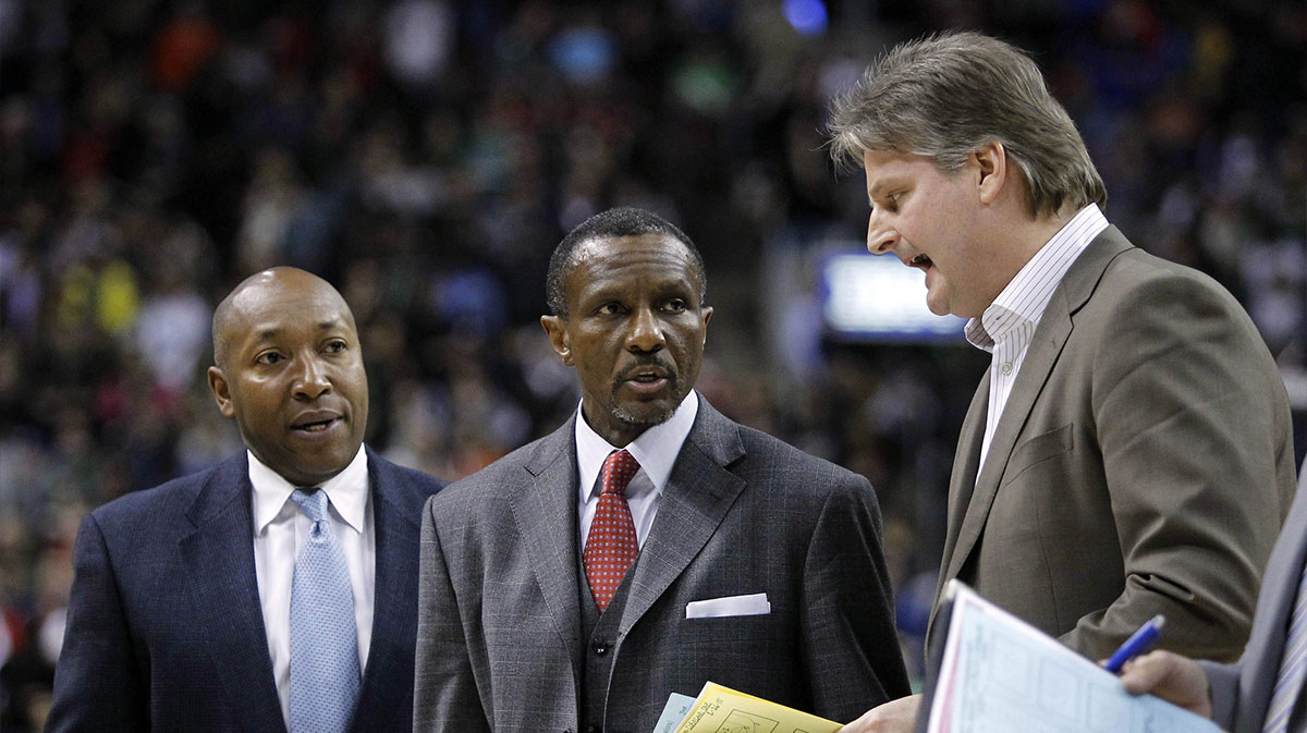 Toronto Raptors assistant coach Johnny Davis (left) and head coach Dwane Casey (center) and assistant coach Scott Roth (right) discuss a play at the end of the game against the Cleveland Cavaliers at the Air Canada Centre. Cleveland defeated Toronto 99-98.